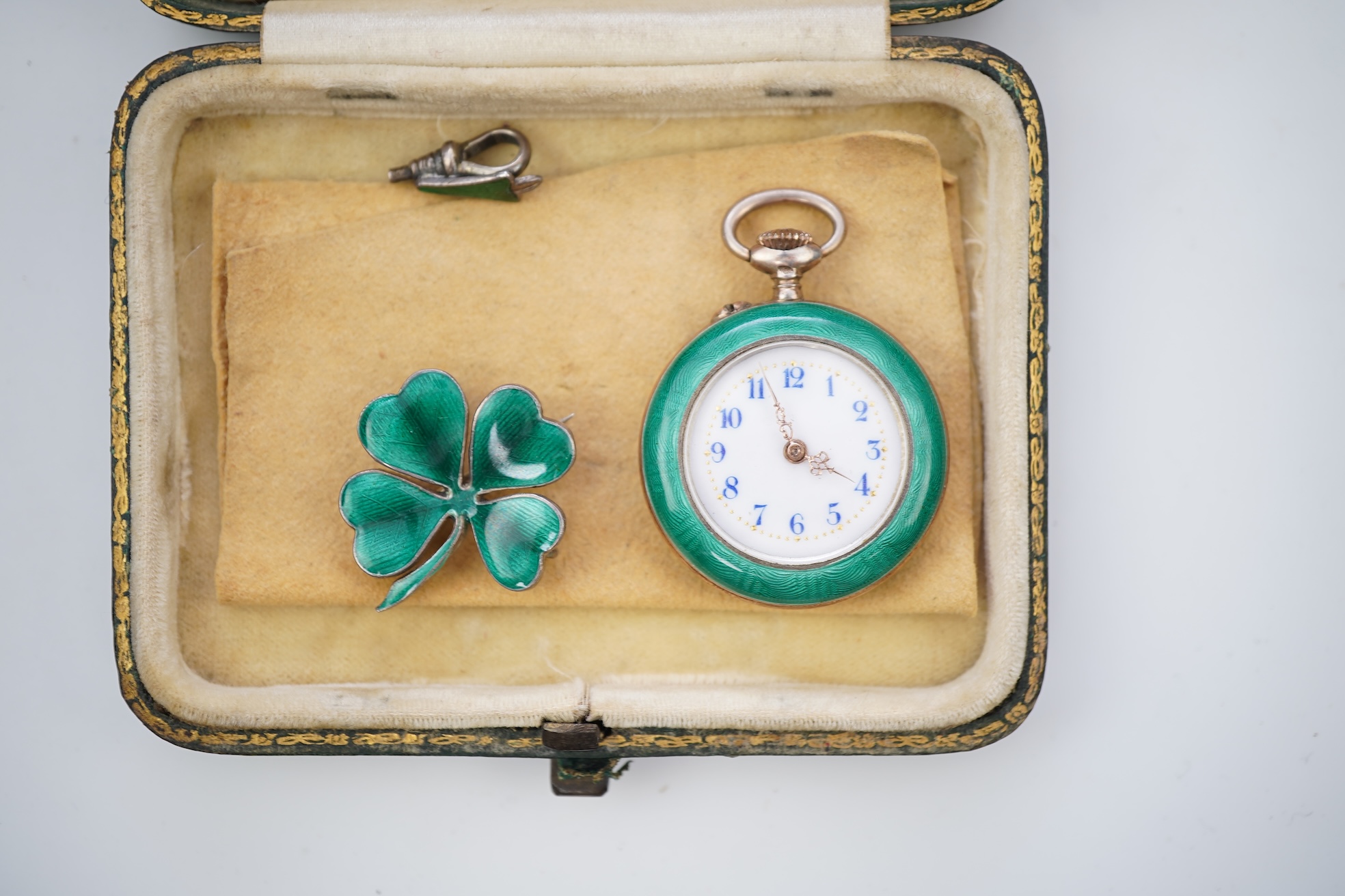 An enamel pocket watch and brooch, early 20th century
